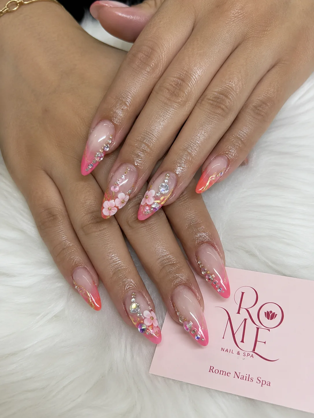Frosted blue French nails with silver floral accents by Rome Nails Spa