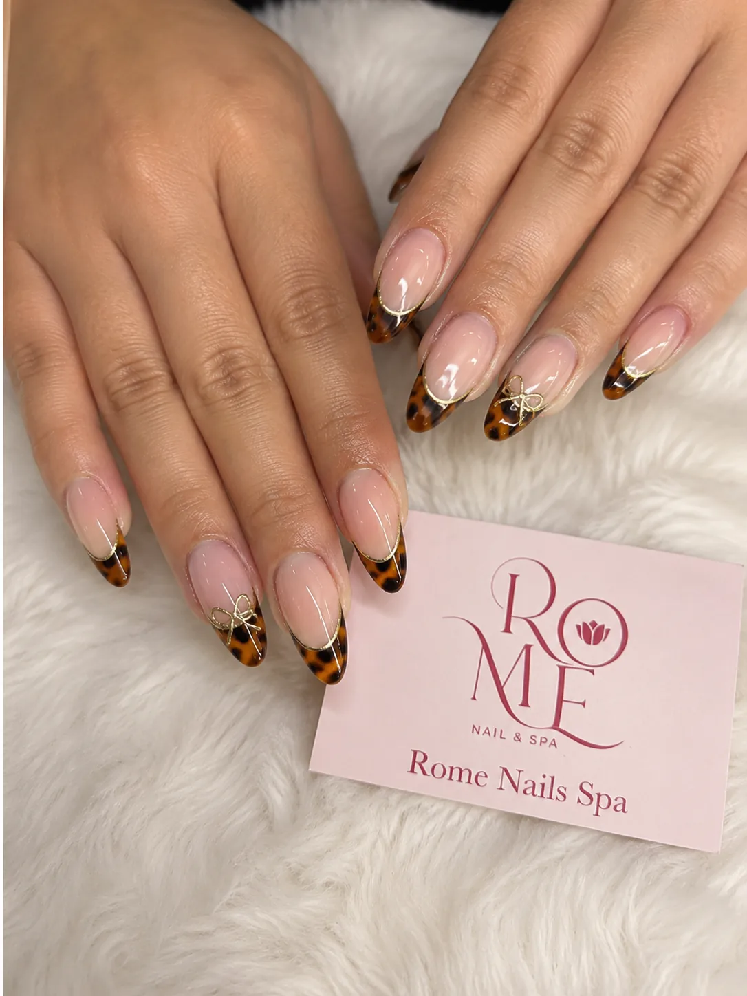 Pink chrome almond nails with fine white lines by Rome Nails Spa